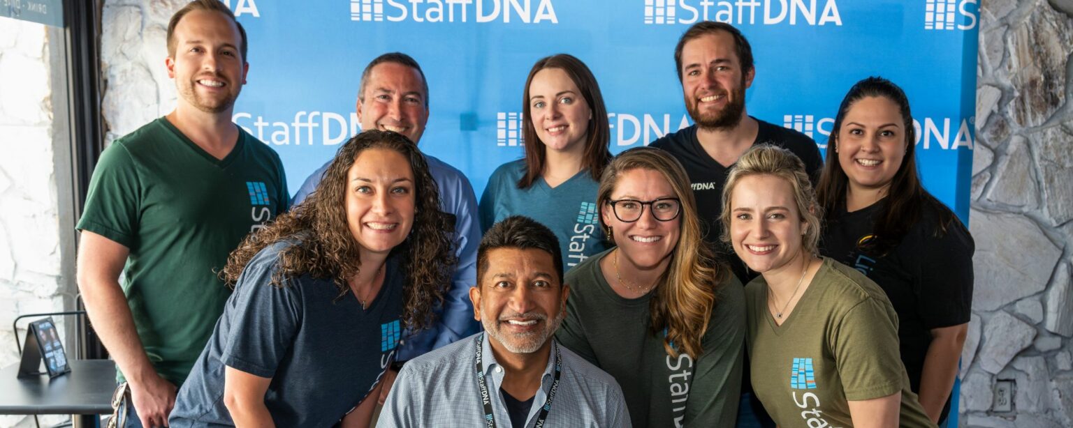 Some of the staffdna leadership smiling at the camera in a group picture
