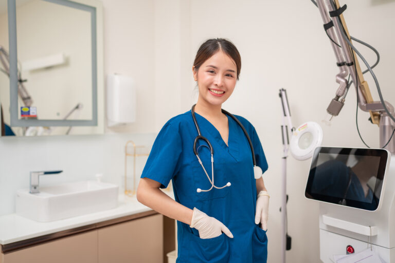 Portrait of asian young nurse with stethoscope beauty clinic - Staffdna